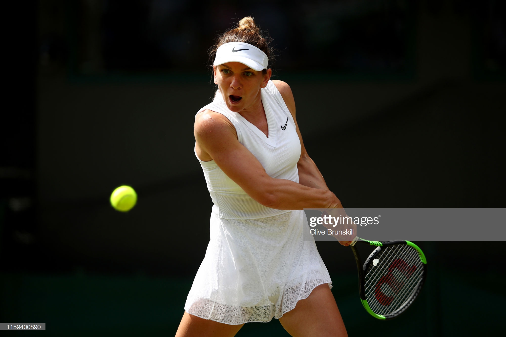 LONDON, ENGLAND - JULY 01: Simona Halep of Romania plays a backhand in her Ladies' Singles first round match against Aliaksandra Sasnovich of Belarus during Day one of The Championships - Wimbledon 2019 at All England Lawn Tennis and Croquet Club on July 01, 2019 in London, England. (Photo by Clive Brunskill/Getty Images)